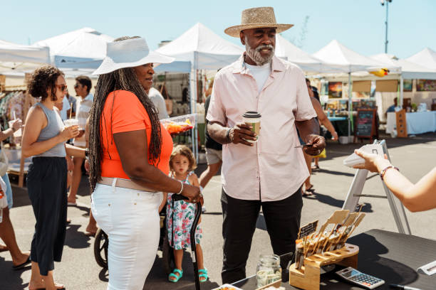 Neighbors enjoying coffee at a Houston community market